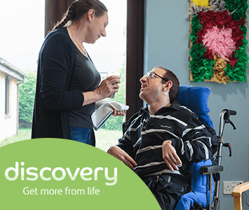 discovery support worker with person she supports