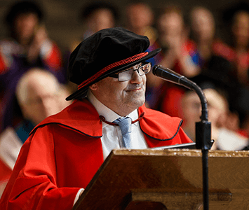 Dr Mark Brookes giving a speech at the University of Kent's awards ceremony where he received his Honorary Doctorate