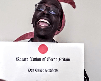 Edwin with his 2nd Dan Black Belt or 'Nidan' certificate