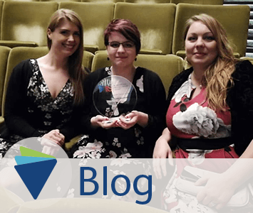 Blog image for autism friendly screenings winning award - autism friendly team pictured with award